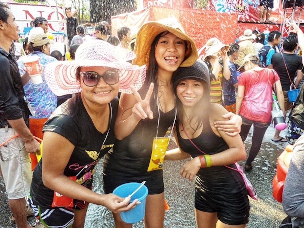 Thai women smile during Thai Water Festival.