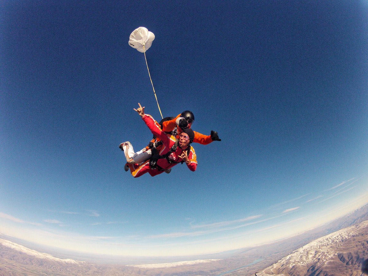 a man poses during a skydive pose.