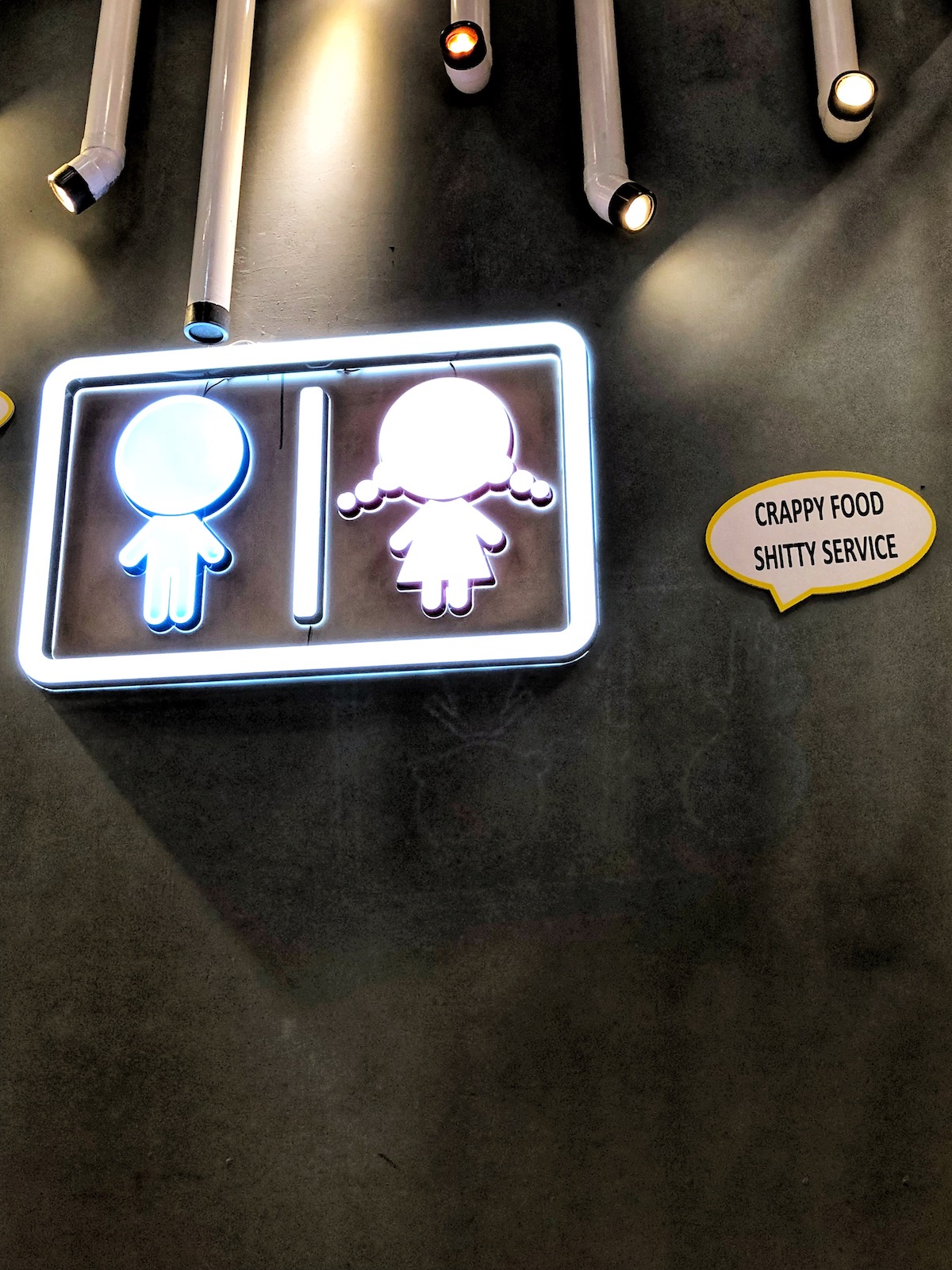Funny signs at a poo-themed cafe in Taipei, Taiwan