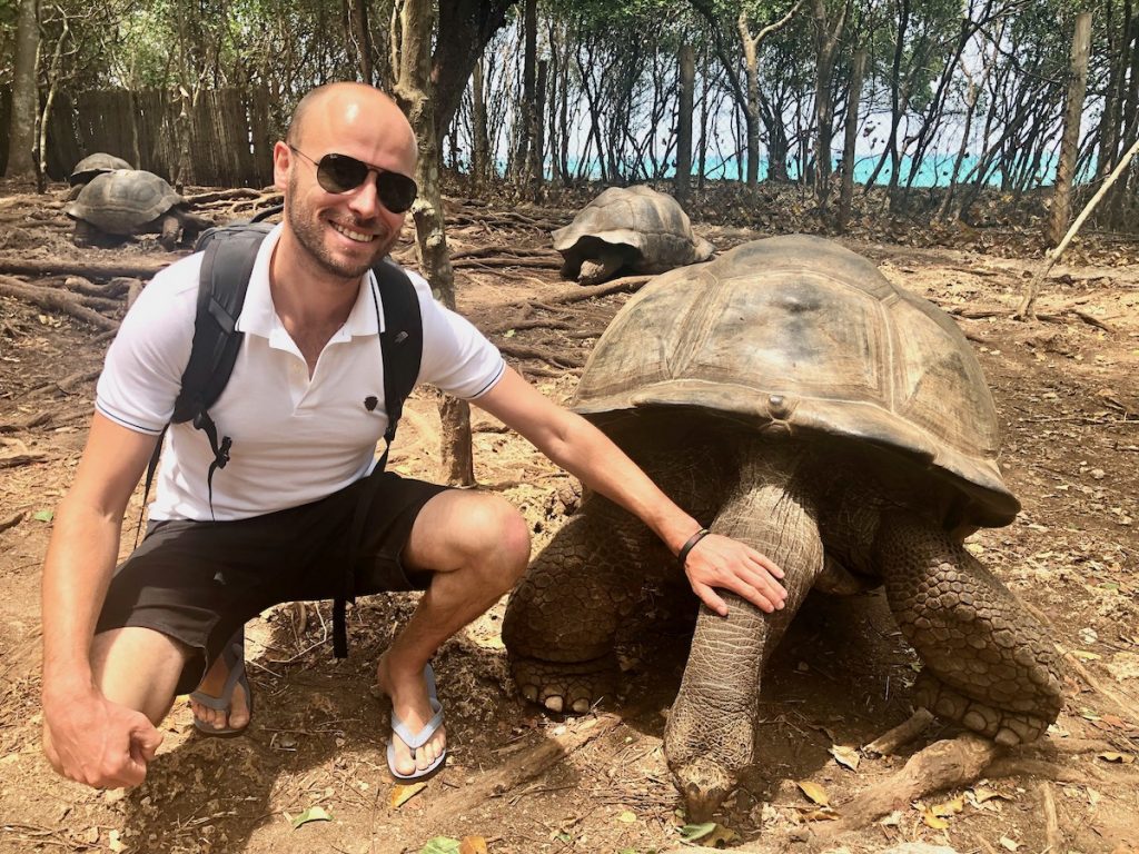 Tourist with giant tortoise