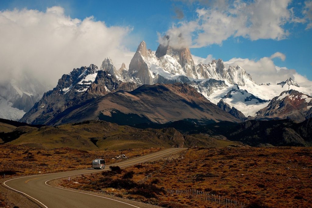 Fitz Roy mountain standing out on a cloudy day behind a windy road in Patagonia, Argentina