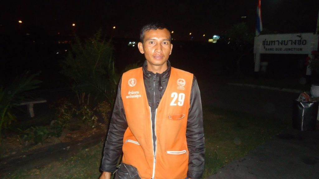 Motorcycle taxi driver in orange vest, Bangkok, Thailand
