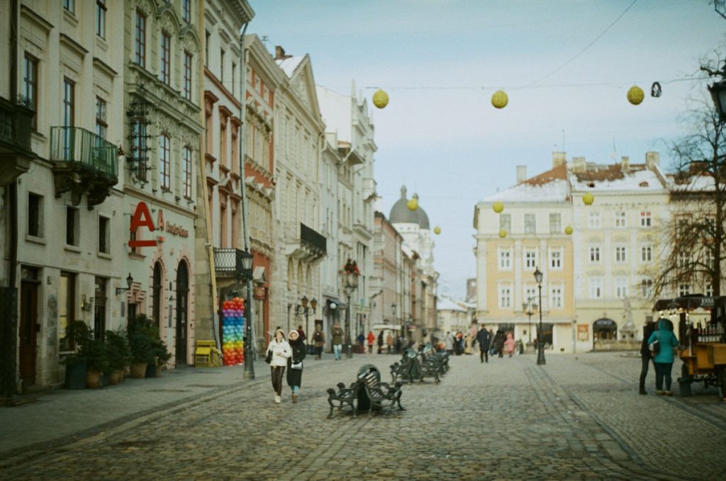 People walking in Rynok Square, Lviv, Ukraine