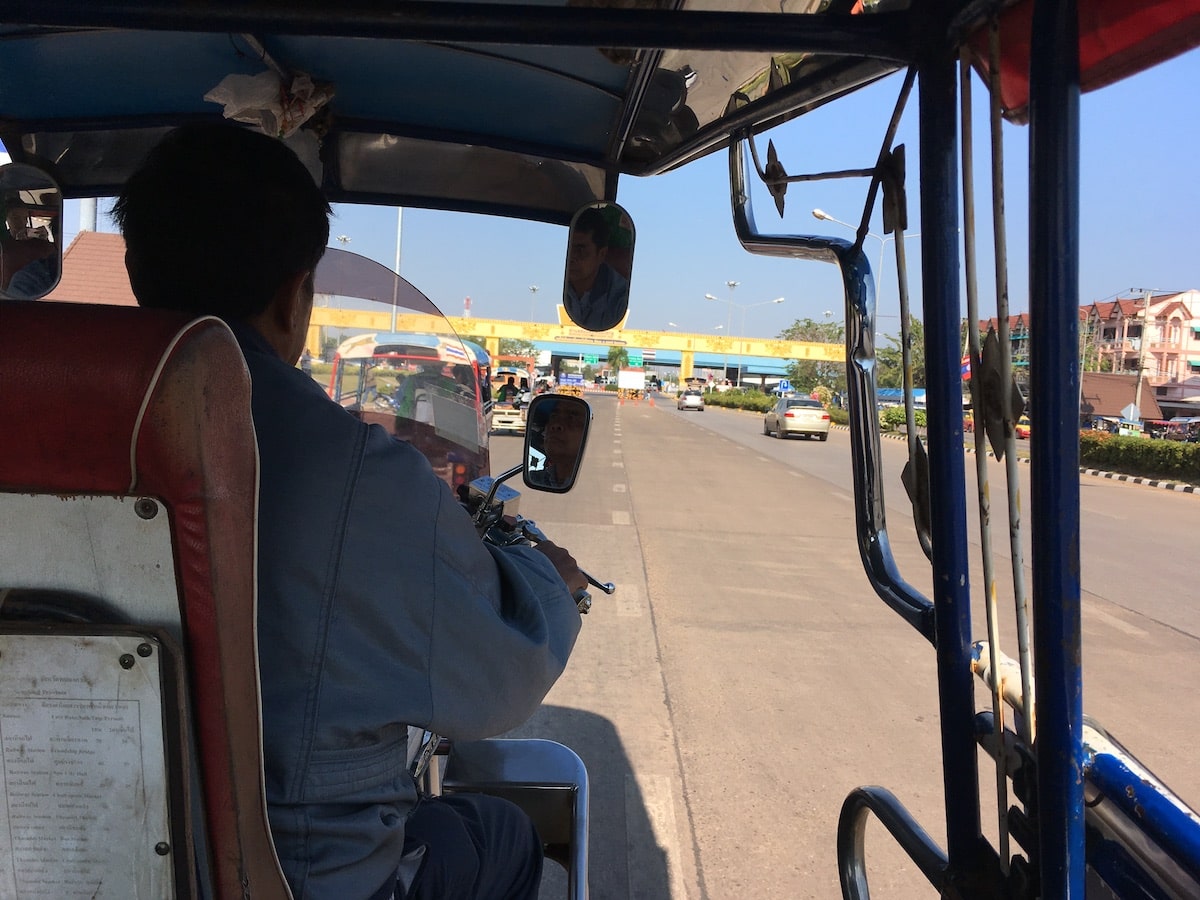 Approaching the Laos border from a tuk tuk during an overland visa trip from Thailand