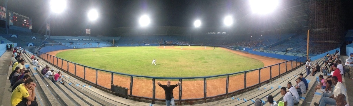 Male tourist at a baseball game at Estadio Latinoamericano stadium in the Cerro district of Havana