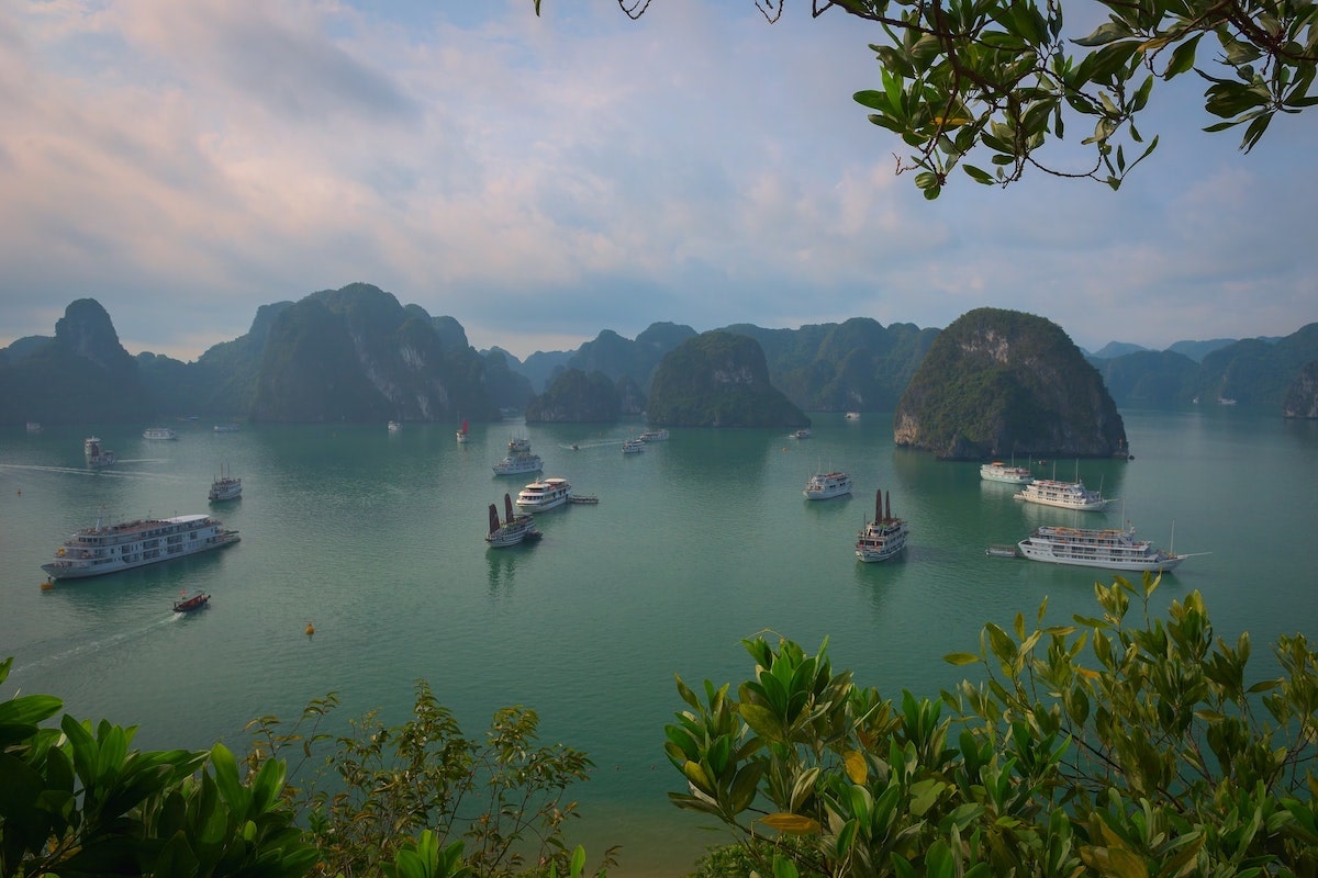 Boats passing through Ha Long Bay during the day