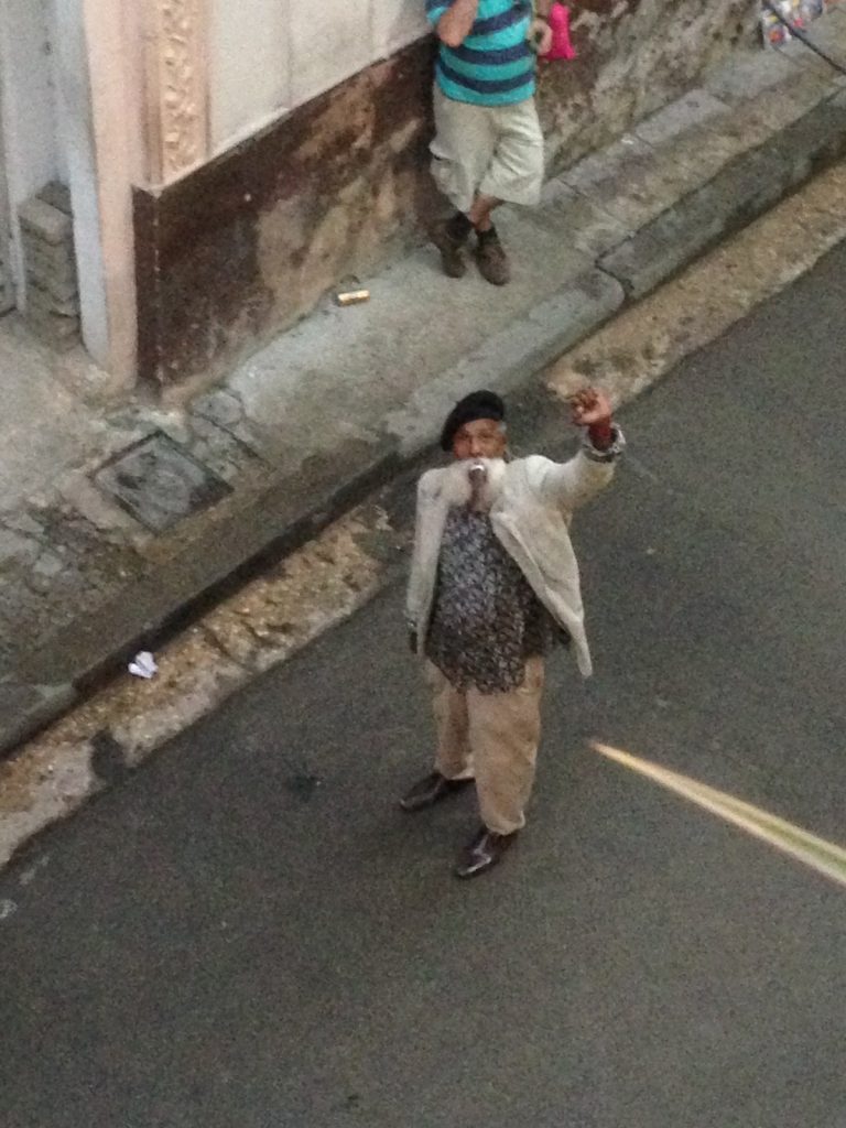 What To Do in Havana: (12) Bucket List Items in Cuba's Capital! • old cuban man in havana Old Cuban man waving in downtown Havana