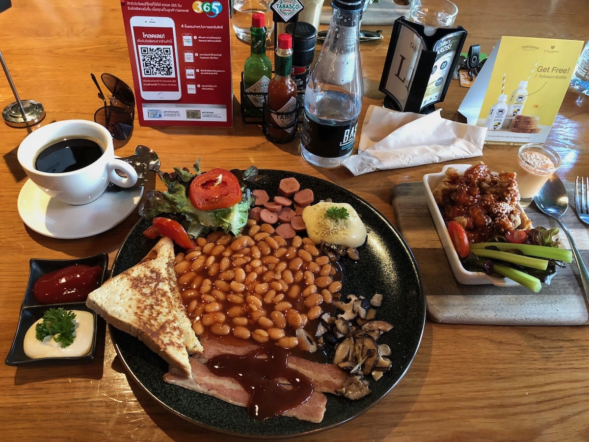 Vegan full English breakfast with a coffee and cauliflower wings