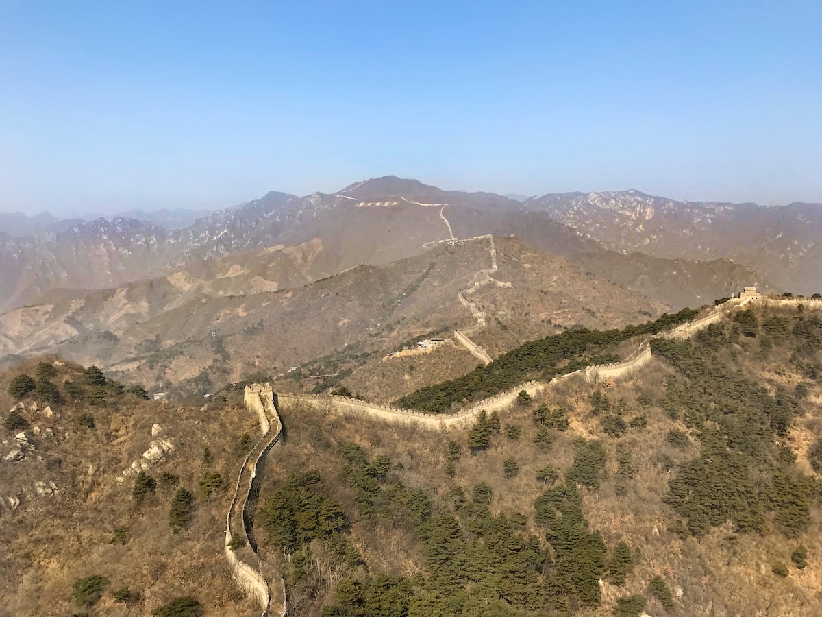 Landscape view of the mountains of the Great Wall of China on a clear day.