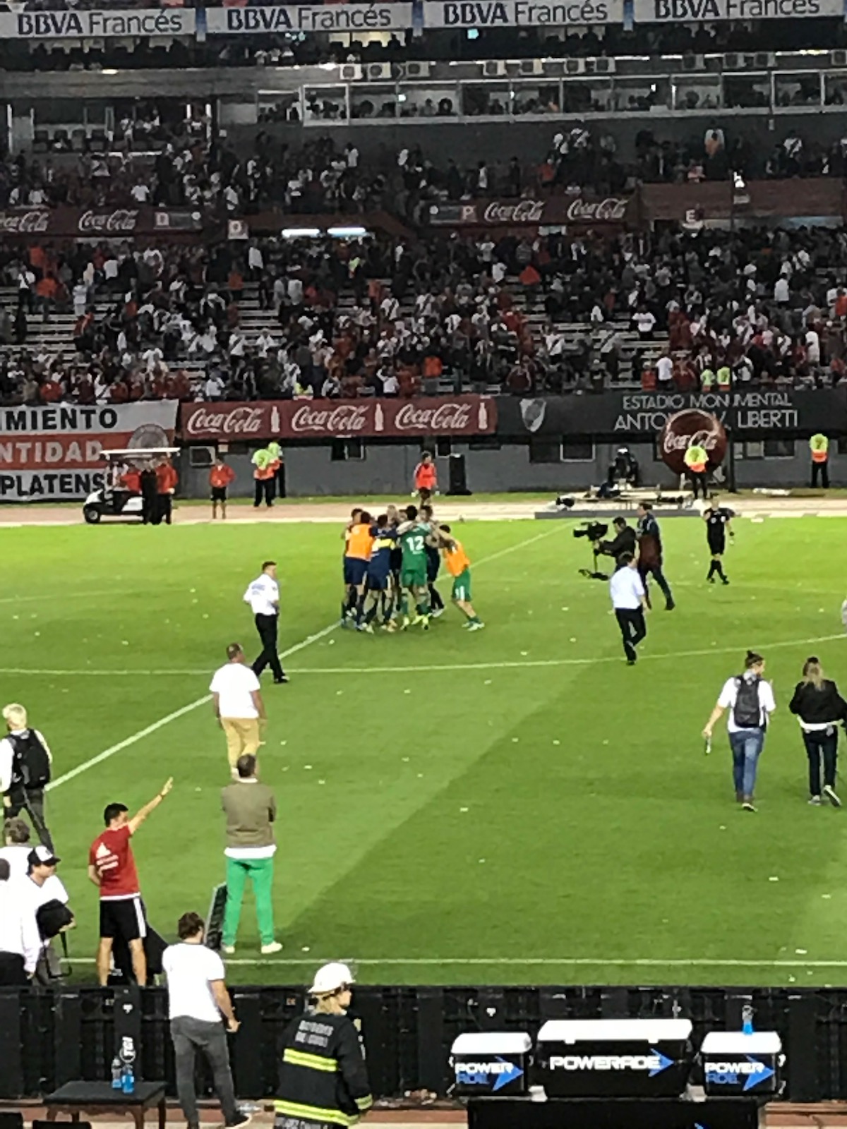 A football team celebrate their victory at the end of a football match in Argentina.