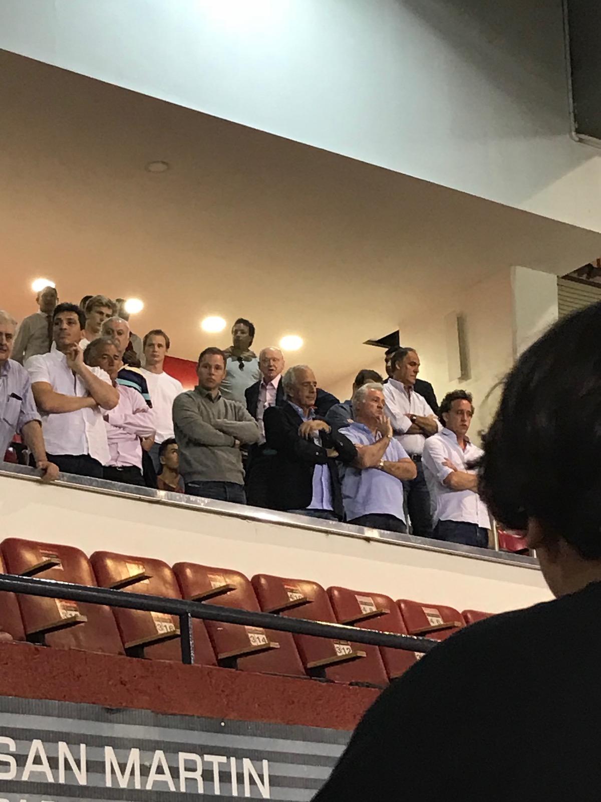 Disgruntled looking men in the football stand after a defeat in Argentina.