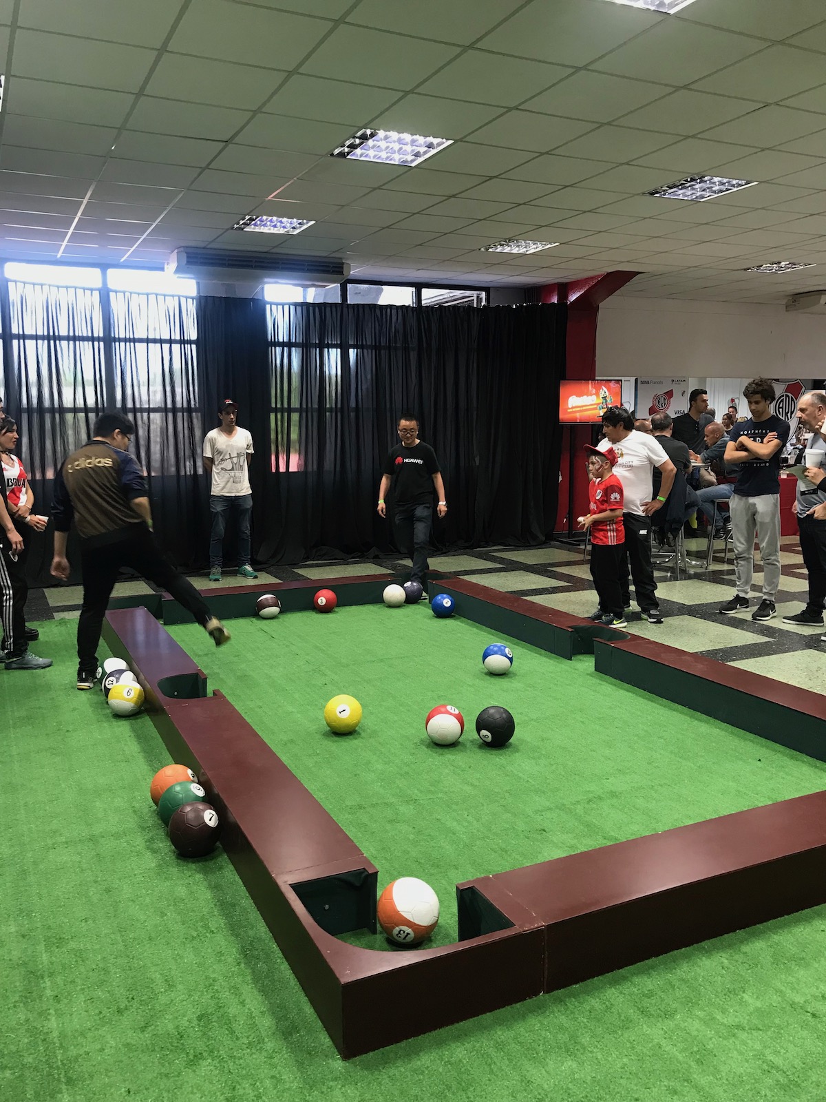 A group of men playing football pool.