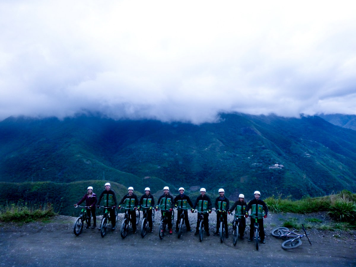 A tour of cyclists poses as they prepare to cycle down Bolivia's Death Road. 