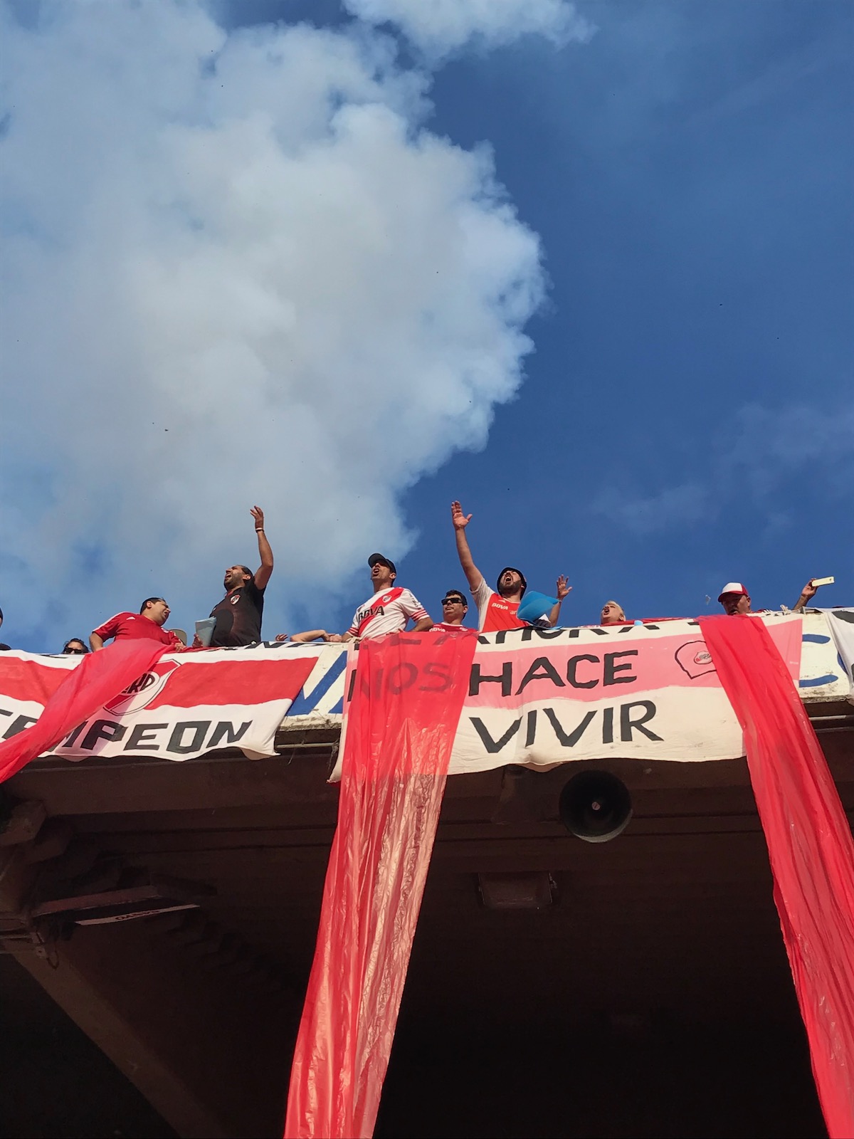 Football fans chant from the high terrace in Buenos Aires, Argentina.