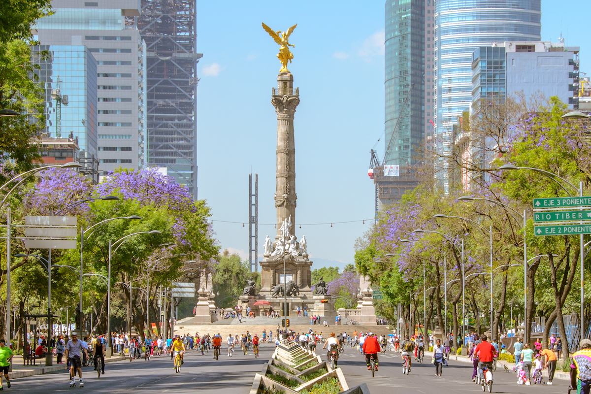 Sunday´s bikers in Paseo de la Reforma at El Angel. In the background, the new Bancomer Tower and Reforma Tower buildings are under construction.