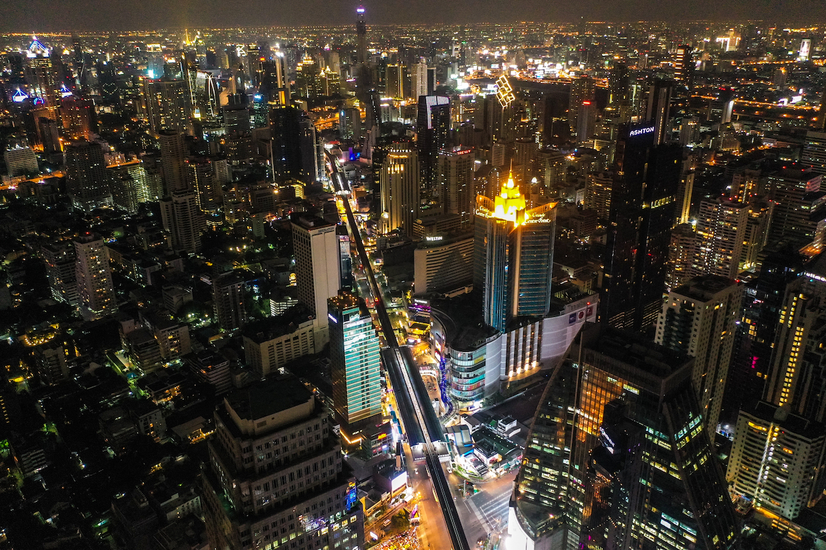 Aerial view of Asoke intersection and sky train station in Bangkok Thailand. Terminal 21 mall and grande centre point, bts asoke and traffic.