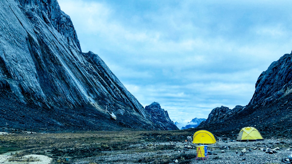 Yellow tents at the base camp of Puncak Jaya