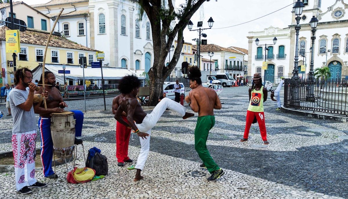 People performing the Brazilian martial art dance of Capoeira. 