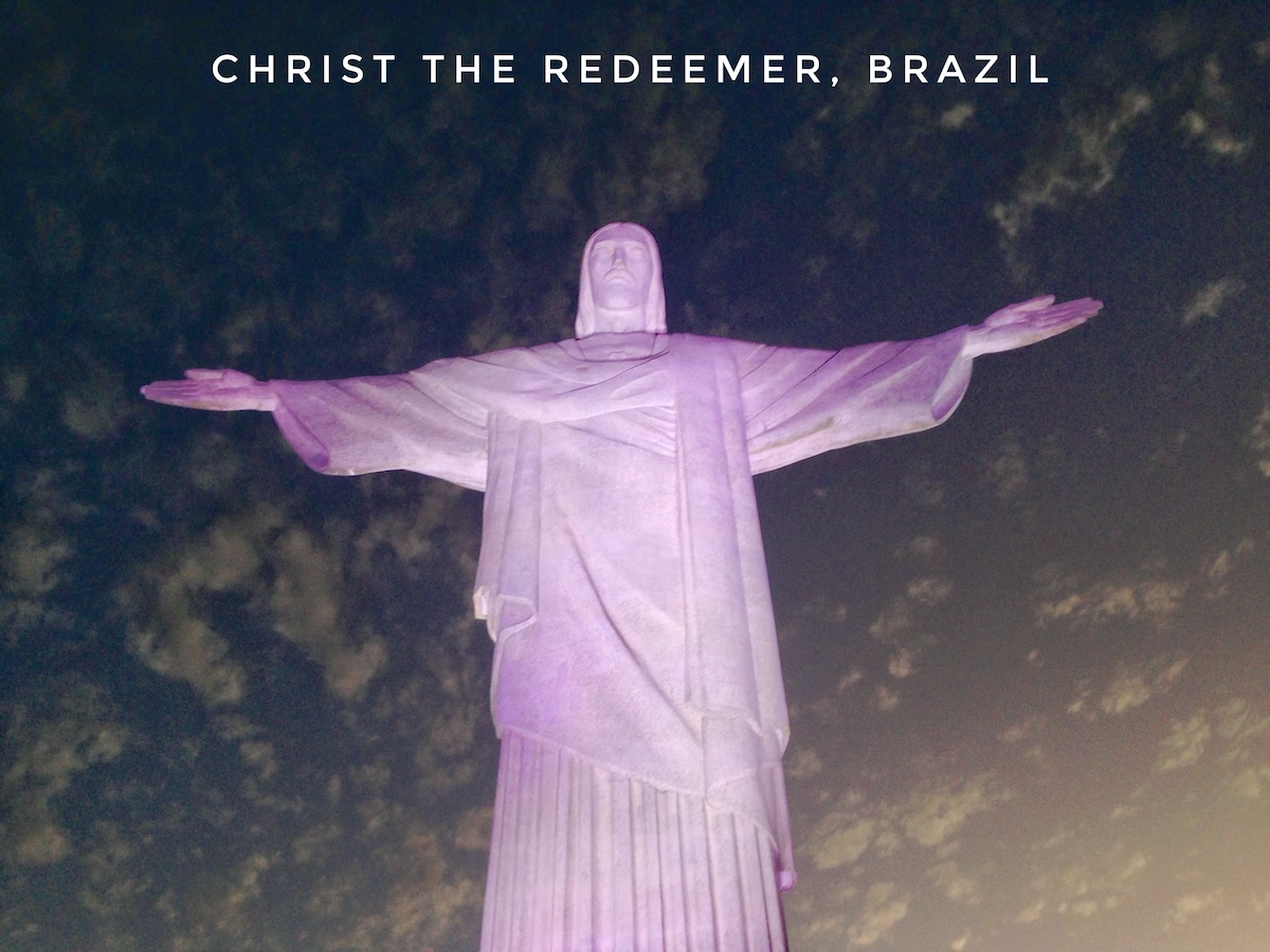 Christ the Redeemer Statue illuminated at light in Rio de Janeiro, Brazil 