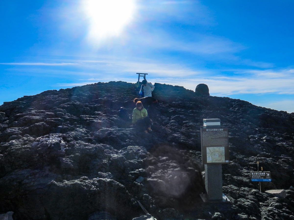 Hikers carefully come down a mountain.