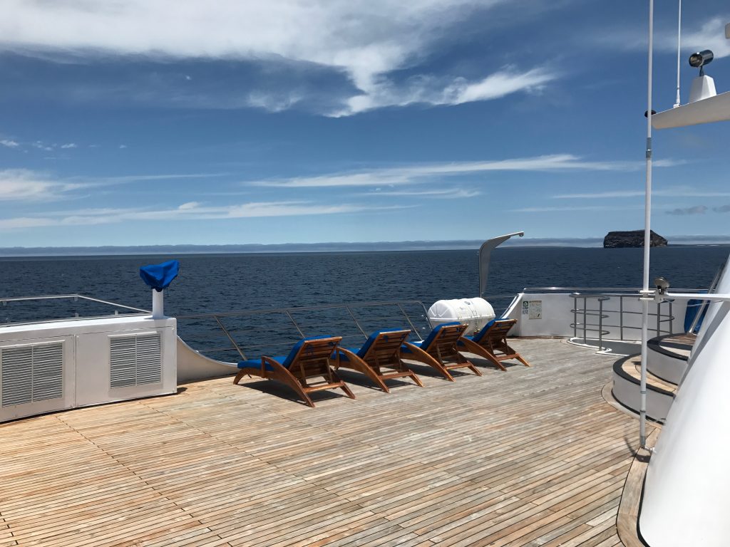 Deck chairs overlooking the sea in the Galapagos Islands.