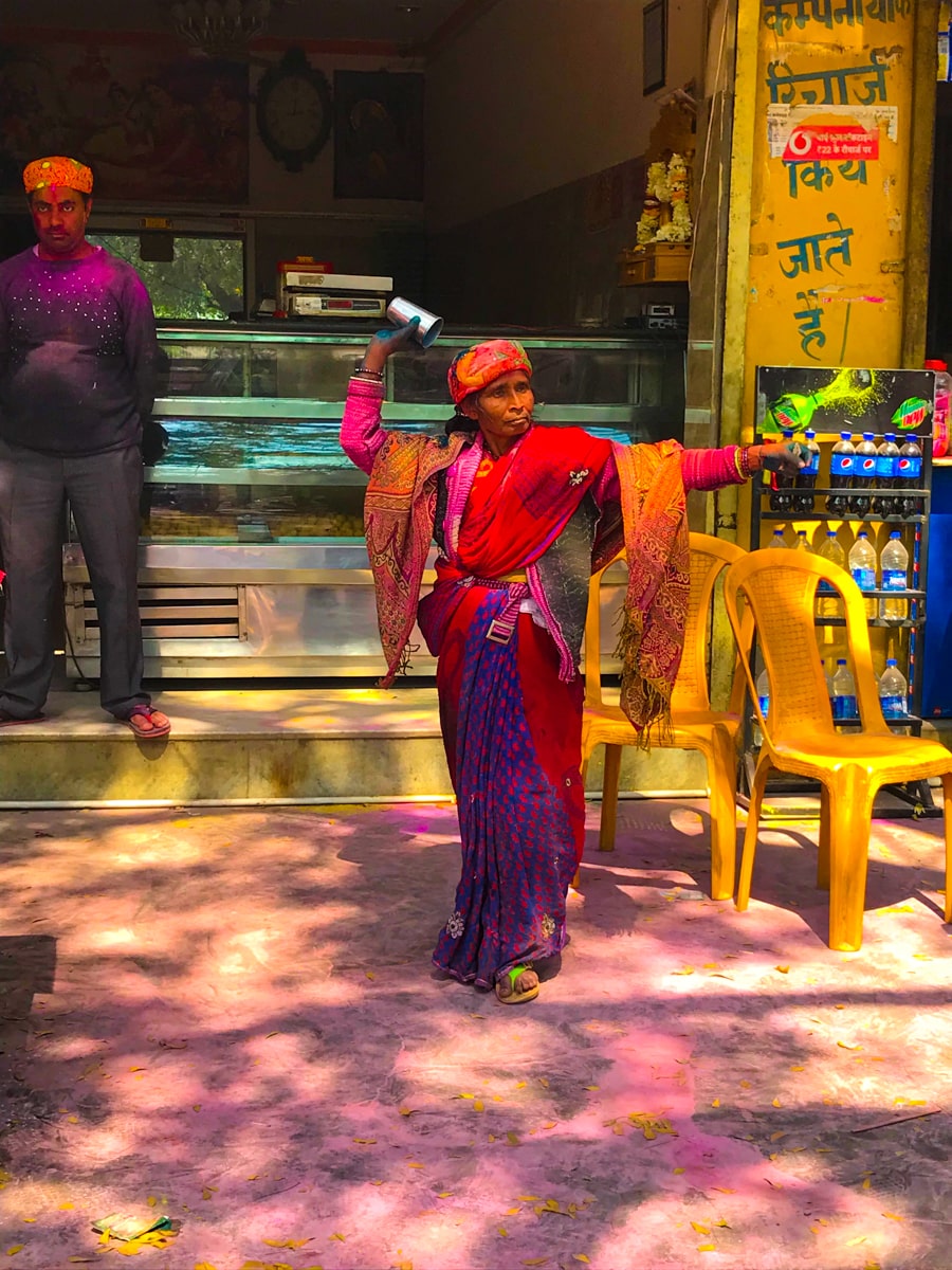 Indian lady dancing during Holi Festival in Vrindavan