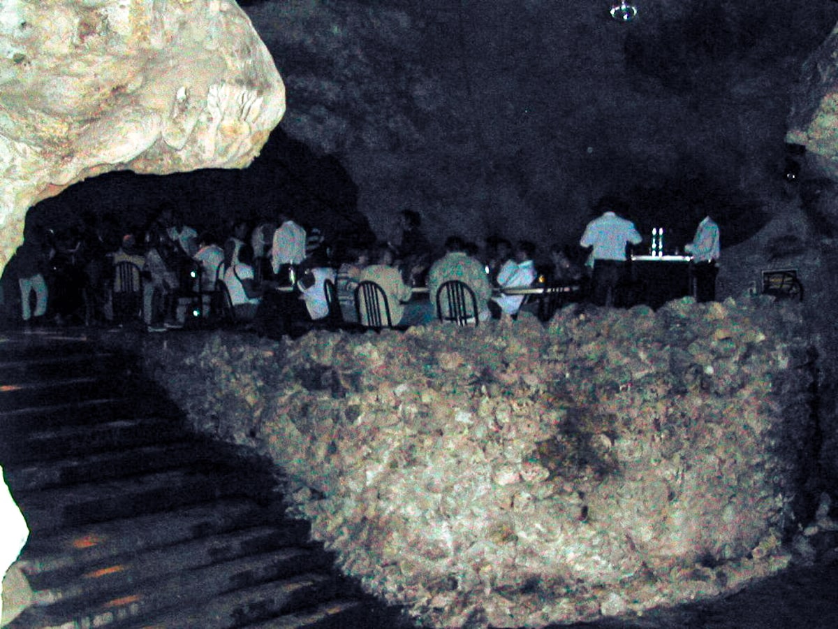 People eating dinner in a cave in Disco Ayala, Cuba.