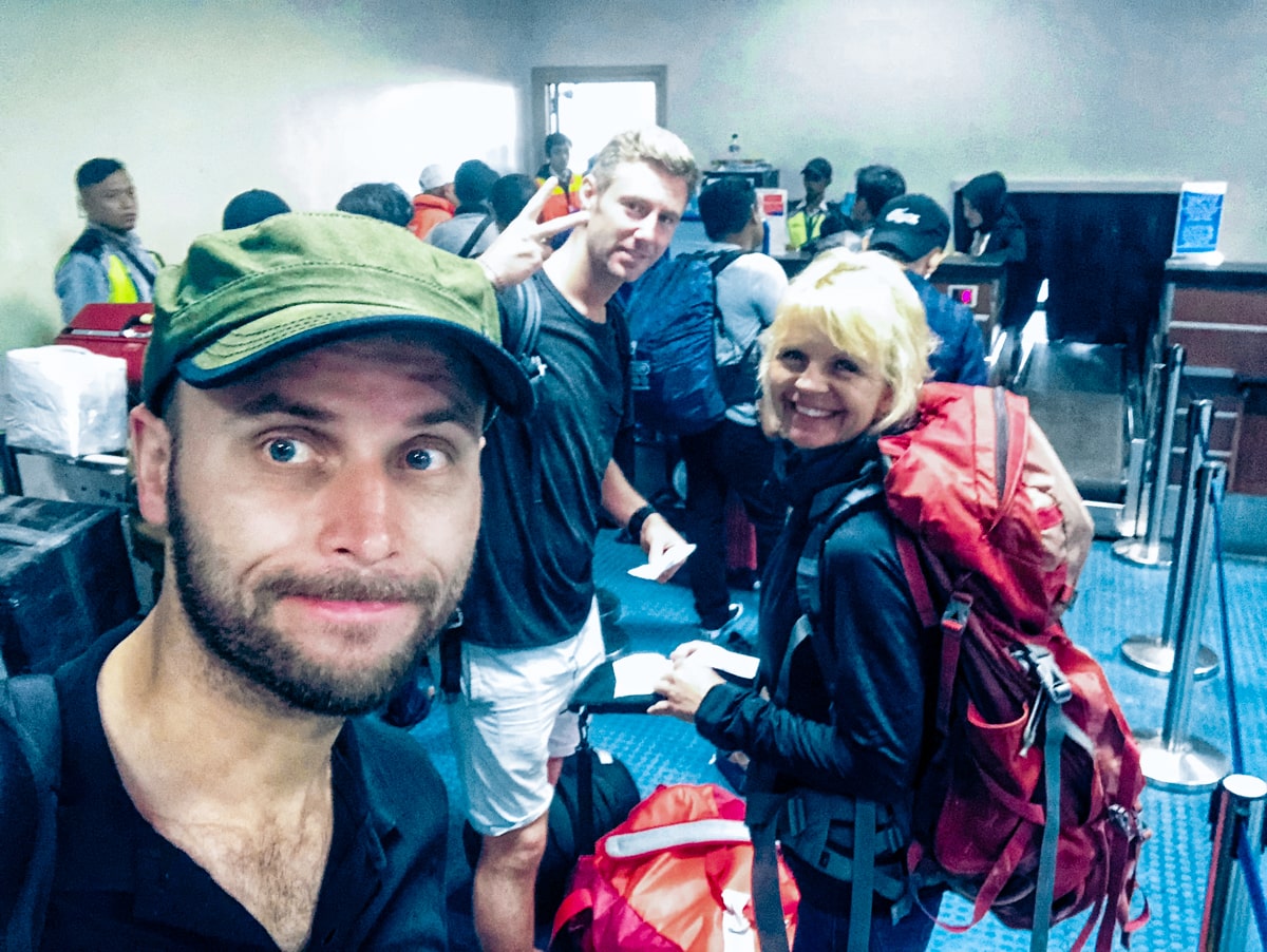 Extreme sports tourists leaving West Papua Airport after climbing Puncak Jaya