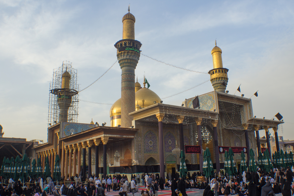 A shrine of two gold domes and four minarets and a large courtyard, Located in the city of Kadhimiya in Baghdad.