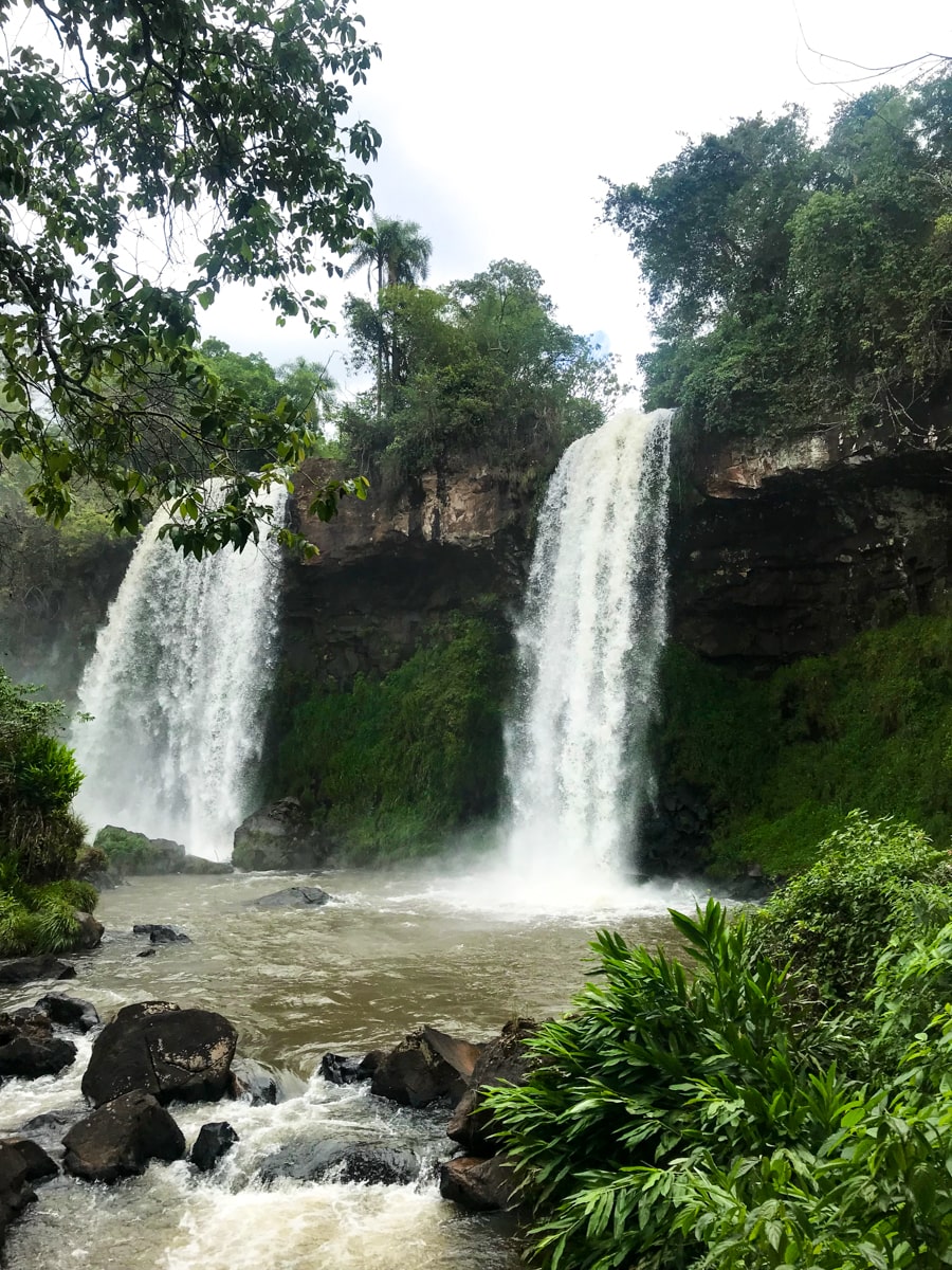 Two large waterfalls flow in Iguazu National Park, Argentina