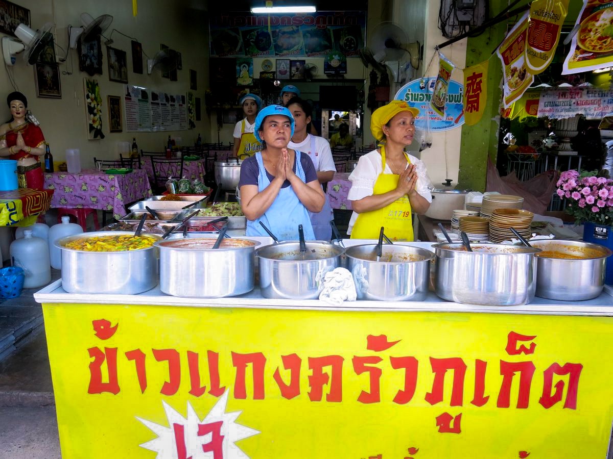 Two ladies at a Jai food stall at the Thailand Vegetarian Festival. 