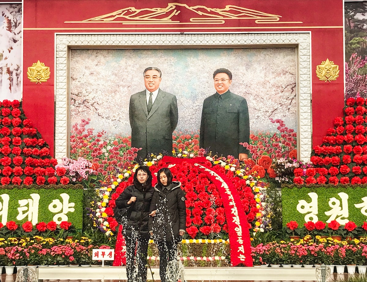 Portraits of late North Korean leaders Kim Il-sung and Kim Jong-il during a "Kimjongilia" flower exhibition celebrating late leader Kim Jong-il, in Pyongyang 