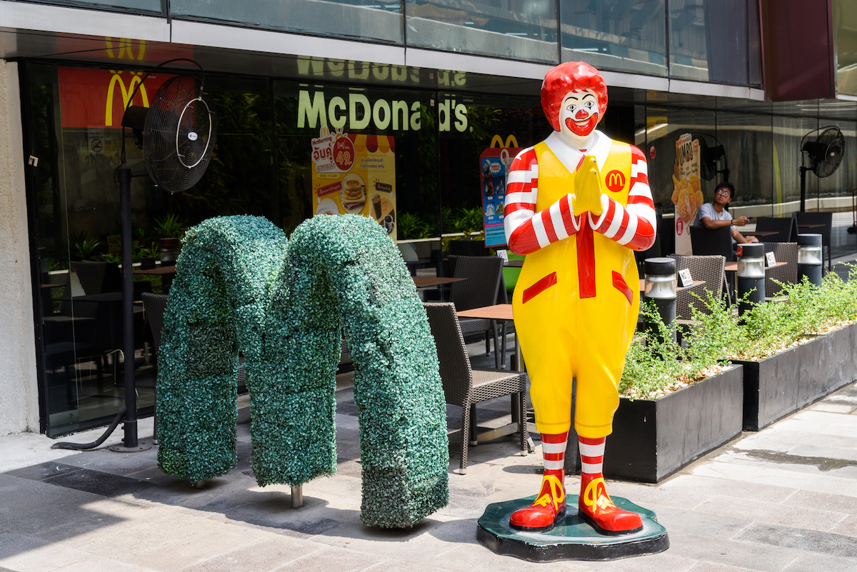 Ronald McDonald making the traditional Thai 'wai' greeting stands outside a McDonald's company outside of Central Ladprao shopping mall