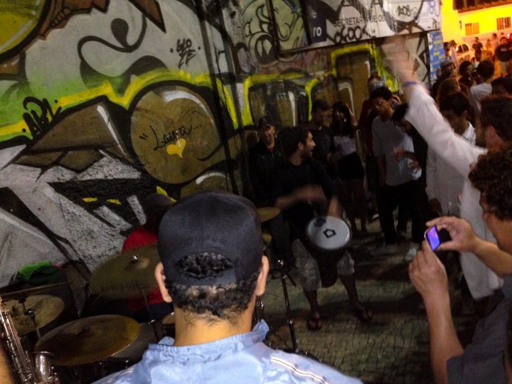 A street party at night with drums and bongos in Rio de Janeiro's district of Lapa