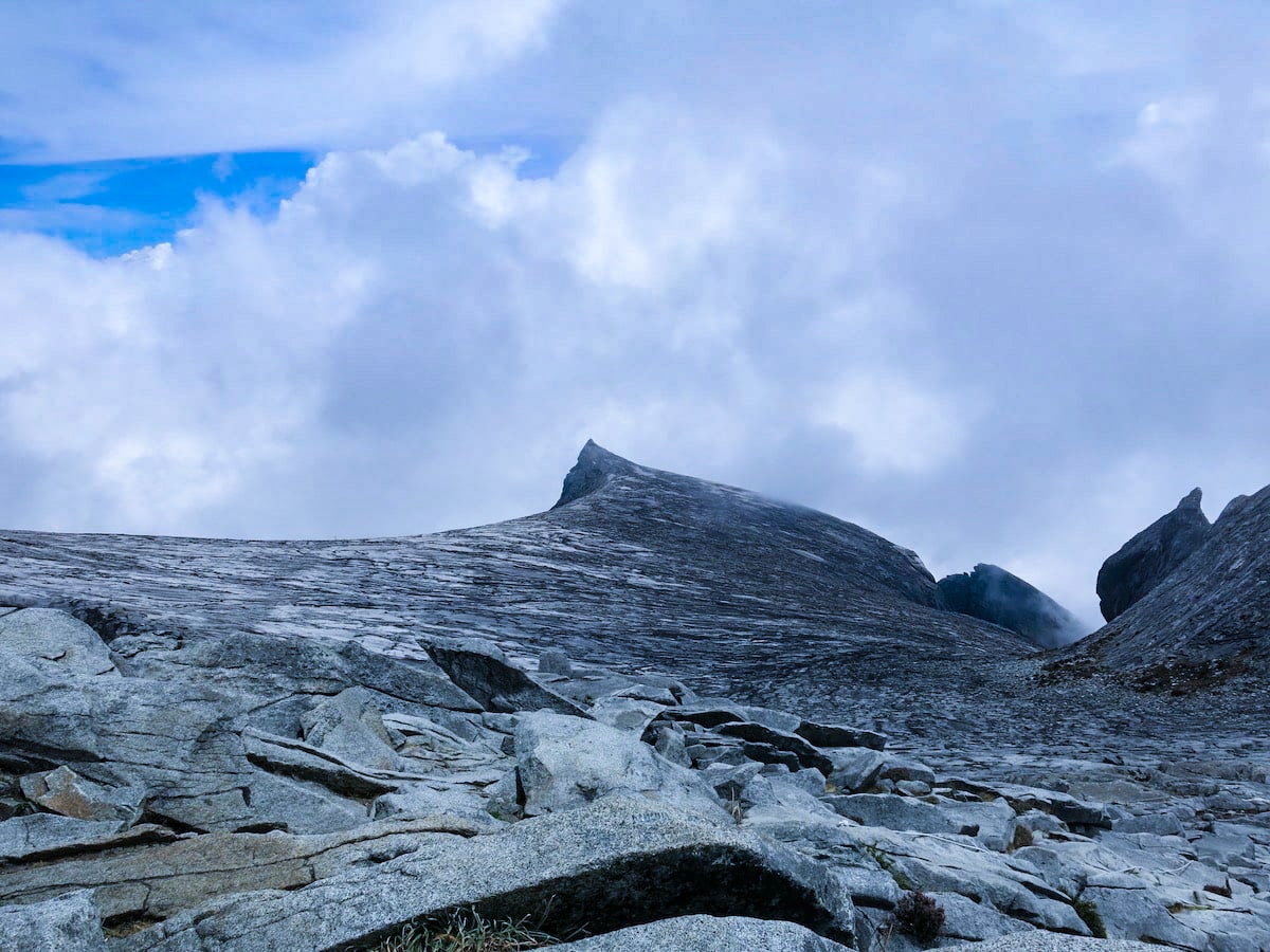 A mountain ridge above the clouds.