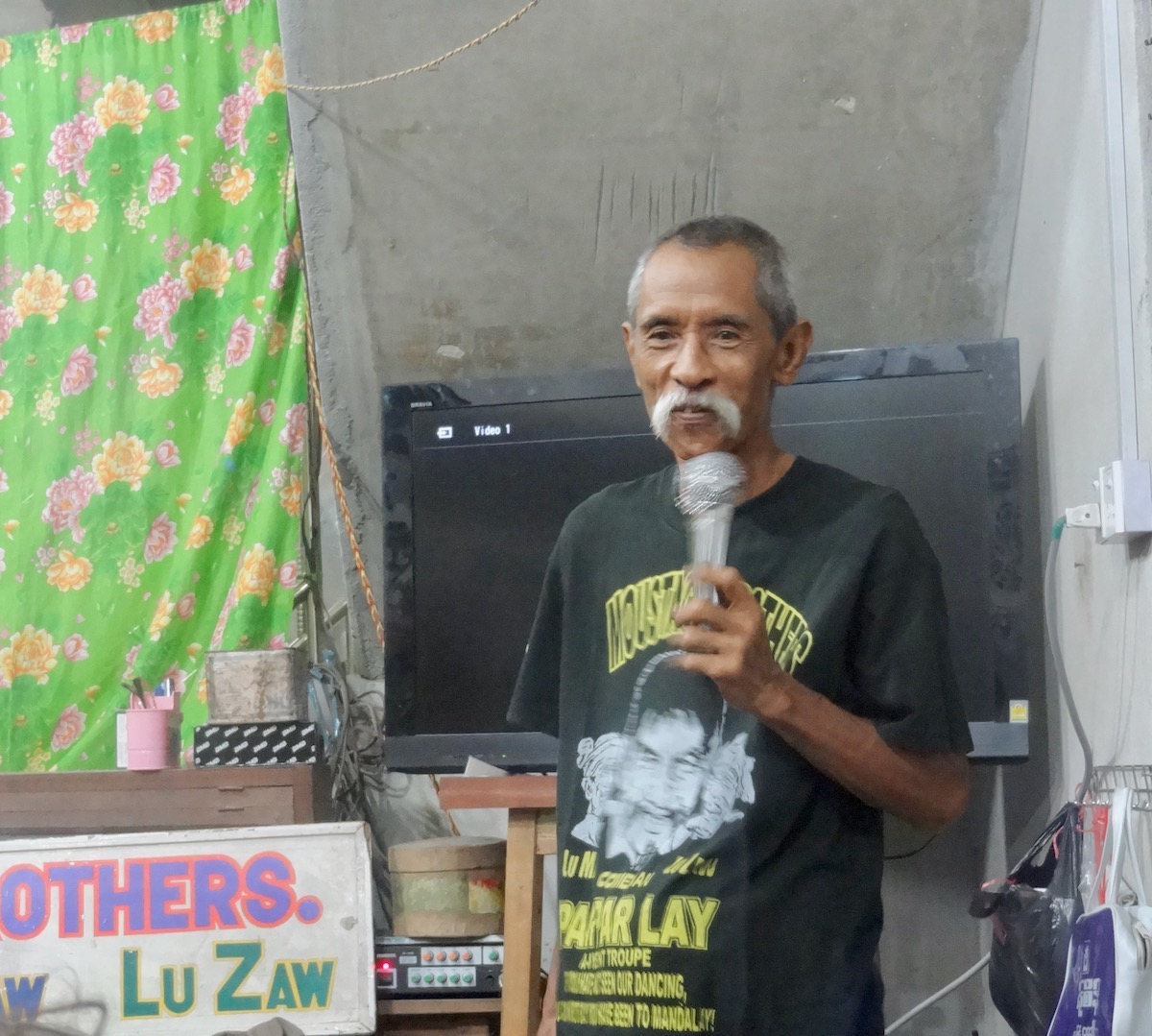 Burmese comedian Lu Maw entertains a small crowd in Mandalay, Myanmar