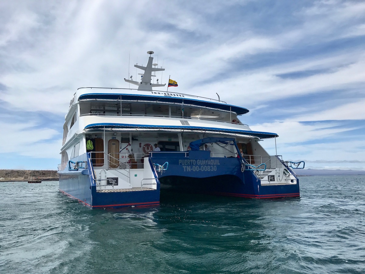 A cruise ship rides on the water during a 5 days Galapagos trip