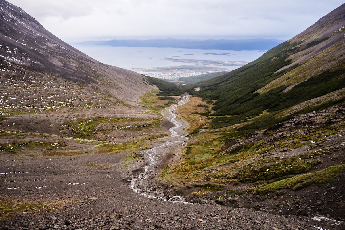 Valley of the Martial glacier and the river with Ushuaia and the Beagle channel in the back