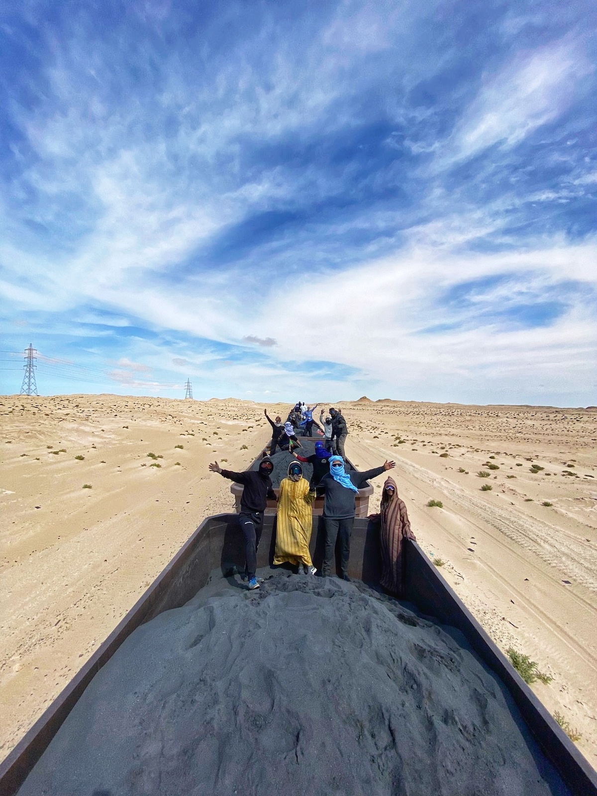 Tourists on the iron ore train in Mauritania riding through the Sahara Desert