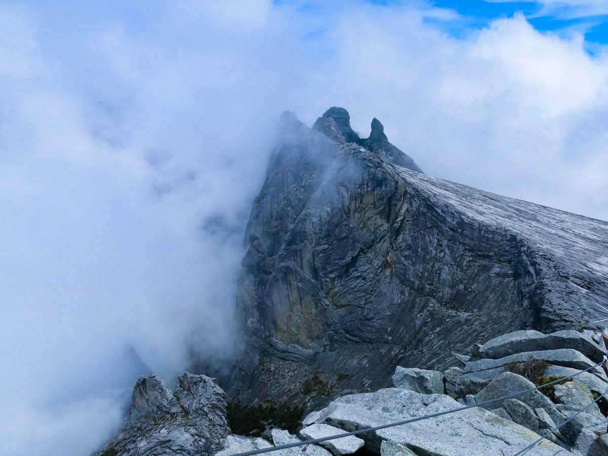 A mountain peak escaping into the clouds.