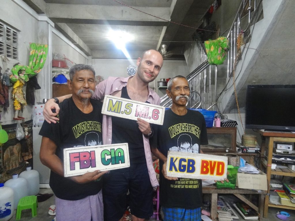 A male tourist meets The Moustache brothers in Mandalay, Myanmar