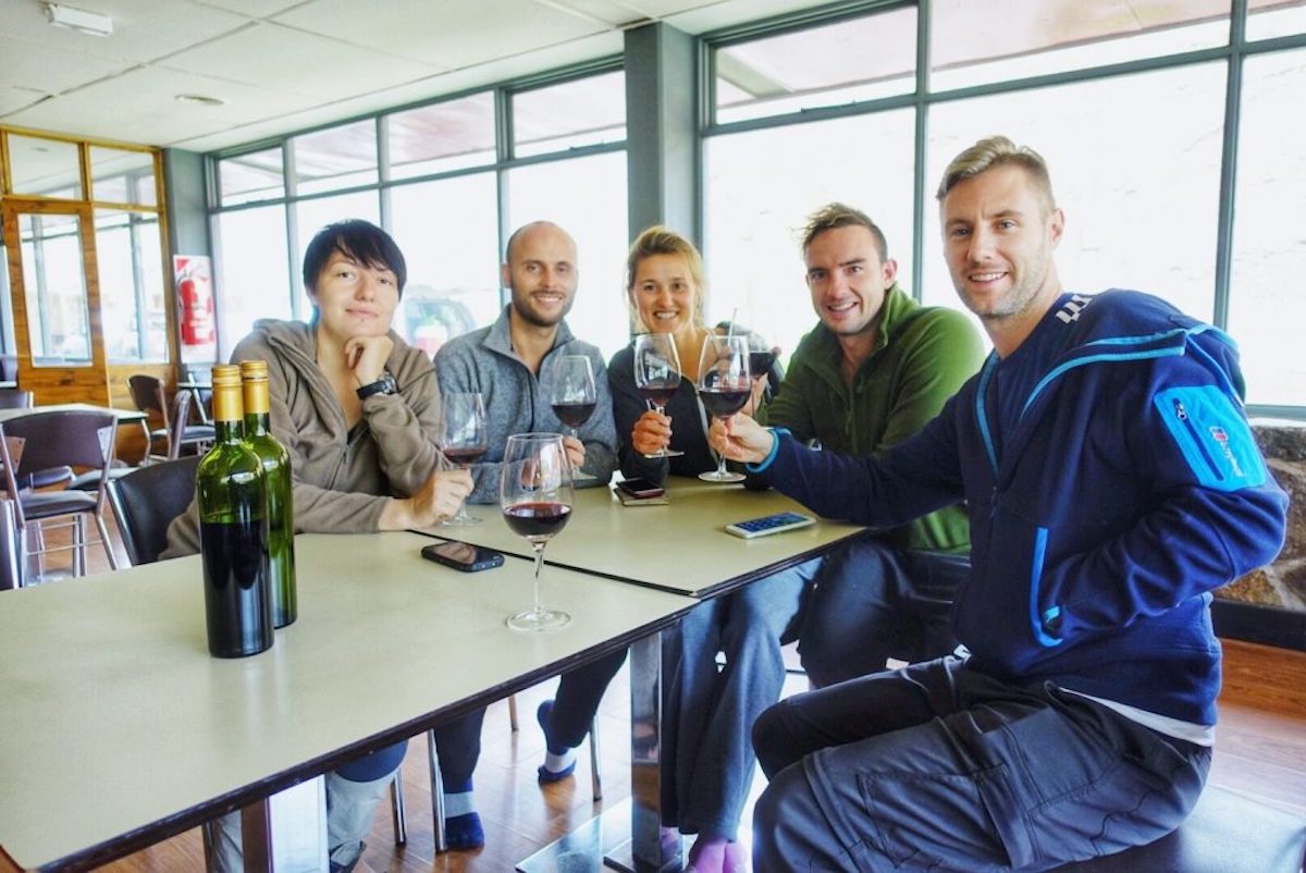 A group of mountain climbers drink wine at Plaza Intentes in Argentina before an attempted climb of Mount Aconcagua