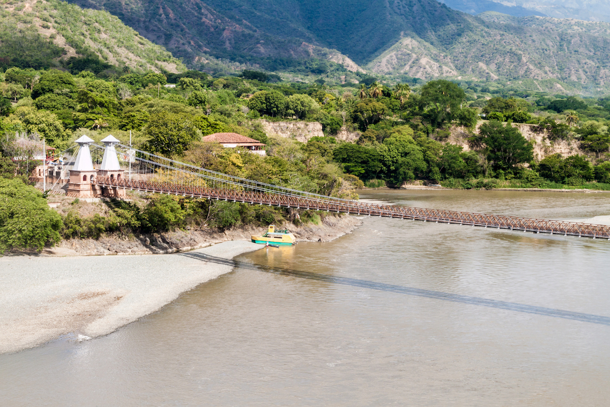 A large bridge across a body of water in Santa Fe de Antioquia, Colombia