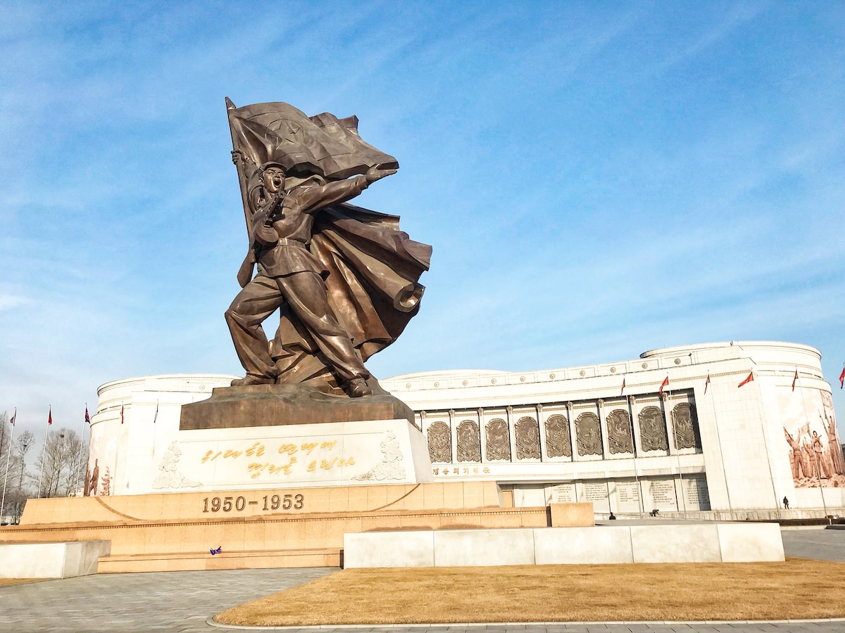 A striking victory-posing monument outside the Victorious Fatherland Liberation War Museum in Pyongyang, North Korea