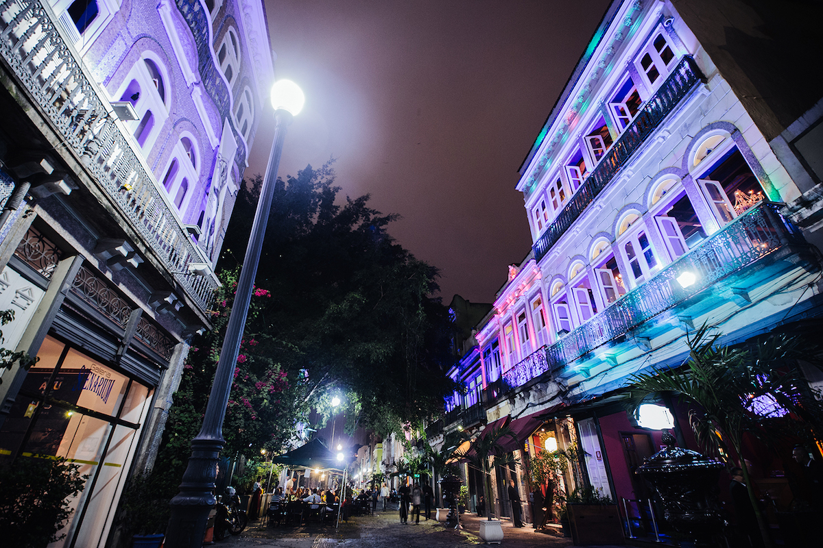 Purple-lit buildings at night in Lapa, Brazil.