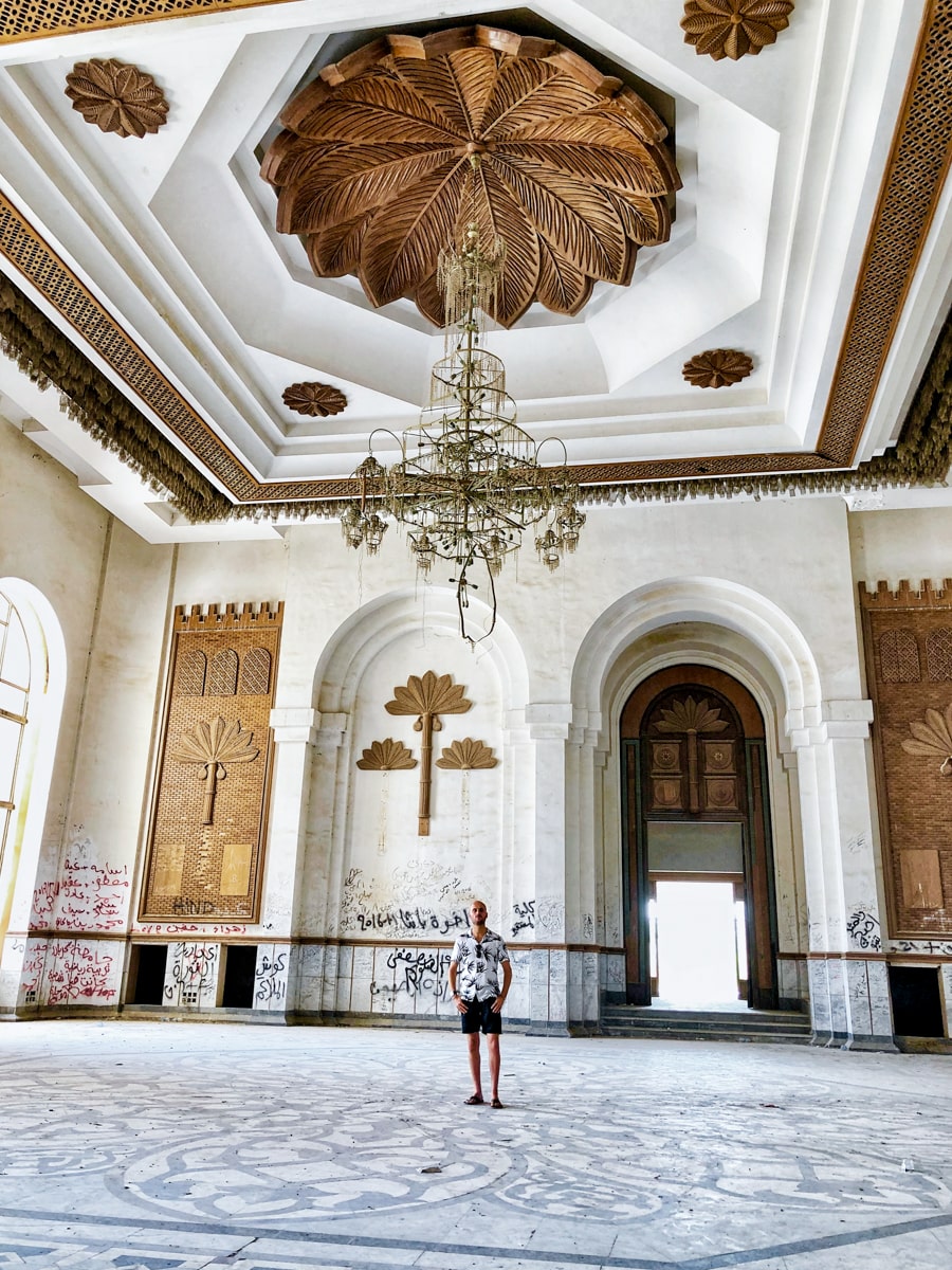 A man stands in the desolate former mansion of Saddam Hussein in Babylon, a popular day trip while visiting Baghdad in Iraq