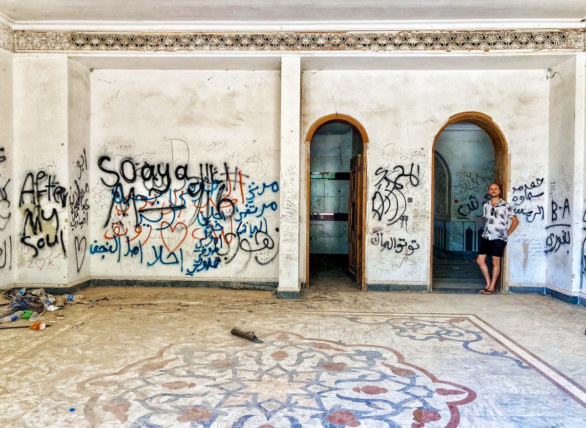 A man stands in Saddam Hussein's former palace in Babylon, a day trip while visiting Baghdad in Iraq