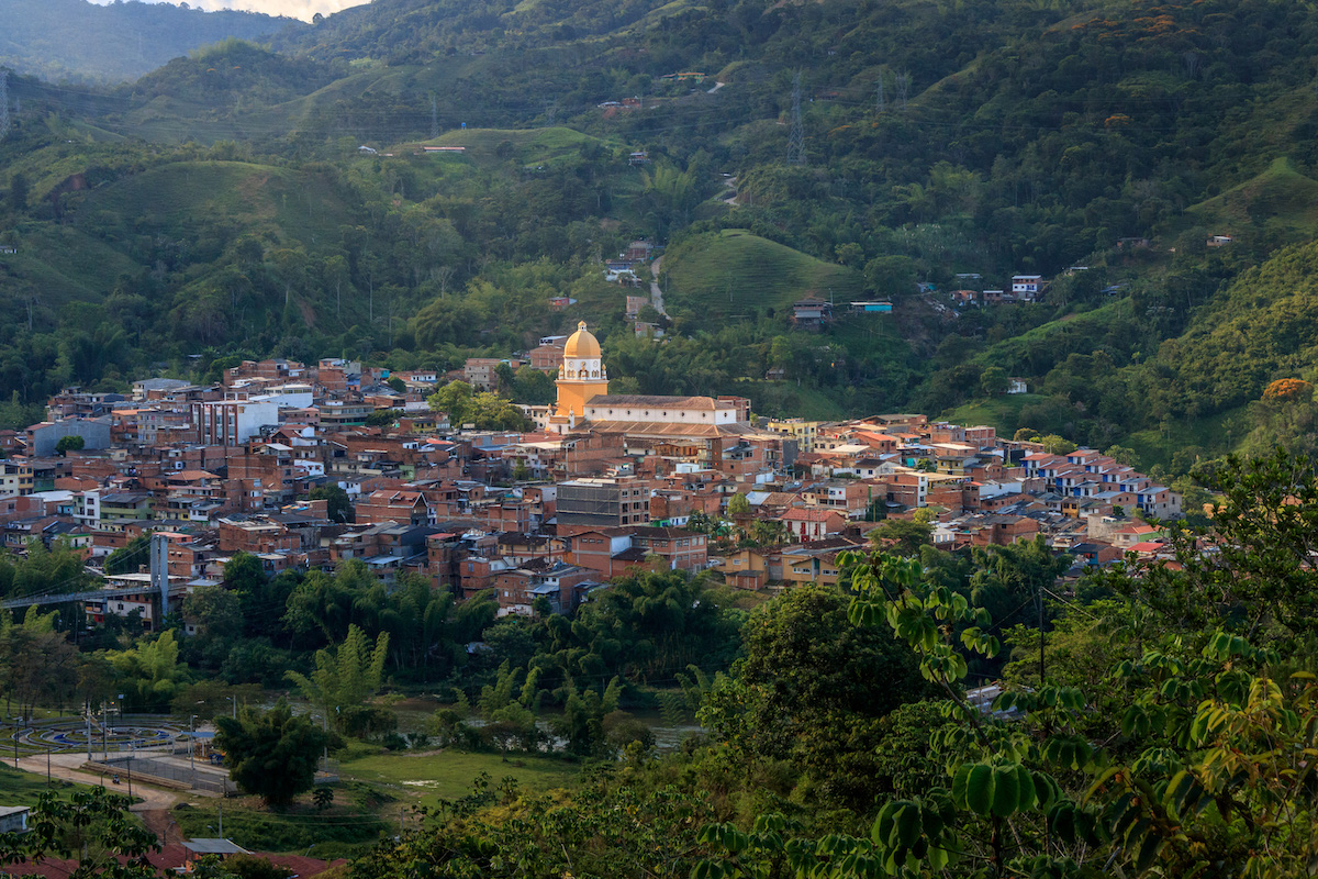 A gold-domed building stands out amongst multiple buildings in the town of San Rafael, just outside of Medellin in Colombia 