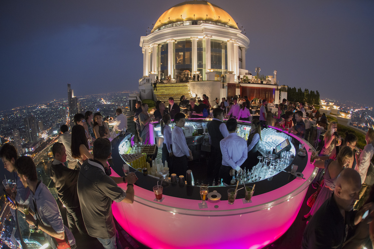 The famous pink Sky Bar at the Riverside Area in the city of Bangkok in Thailand, busy with staff and customers 