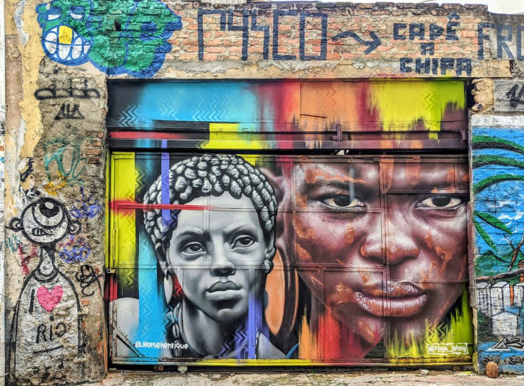 Portrait street art of two black people in Lapa, Brazil.